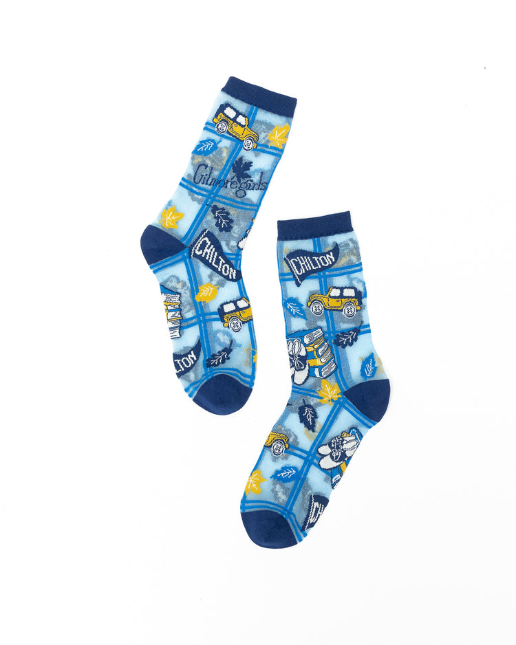 Sock Candy Gilmore Girls Chilton plaid sheer crew socks featuring a school uniform crest motif on a white background.