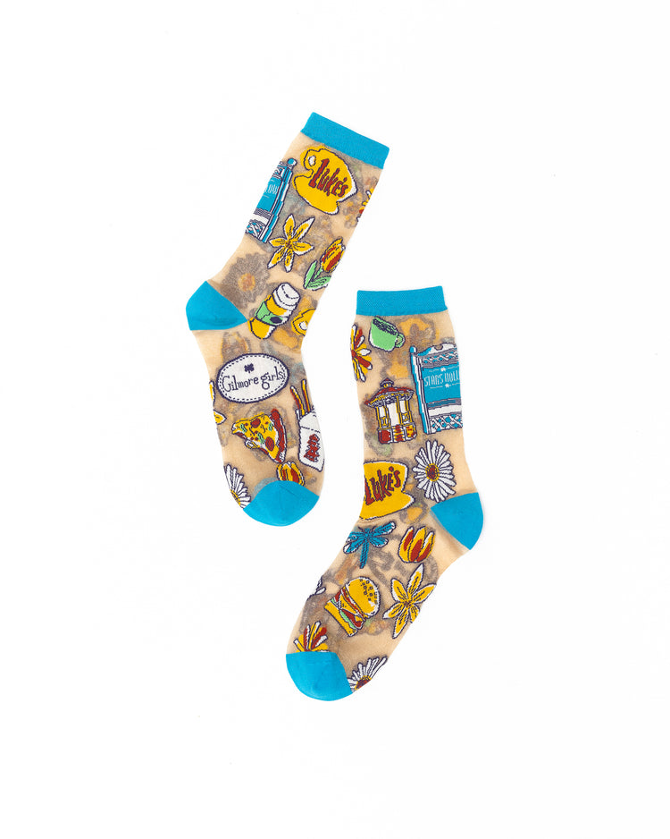 Sock Candy Gilmore Girls Stars Hollow sheer socks with detailed town gazebo and daisy prints.