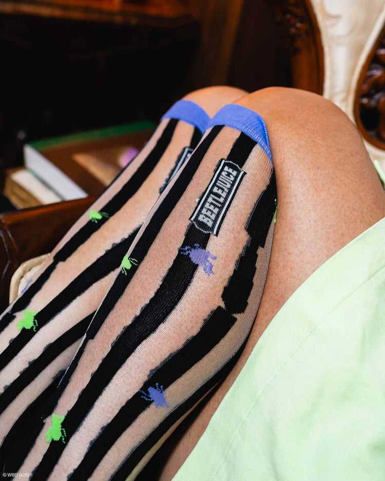 Sock Candy Beetlejuice™ Striped Knee High Sheer Sock Sheer Knee Highs Fashion Socks Striped Knee Highs Beetlejuice Socks Beetlejuice Knee Highs Halloween Socks